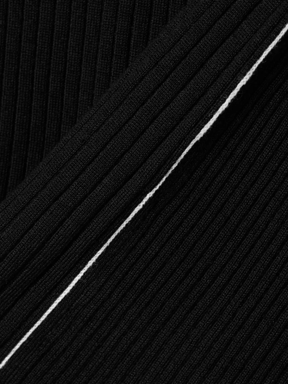 Close-up detail of the Maria McManus Ribbed Merino Wool Turtleneck Sweater