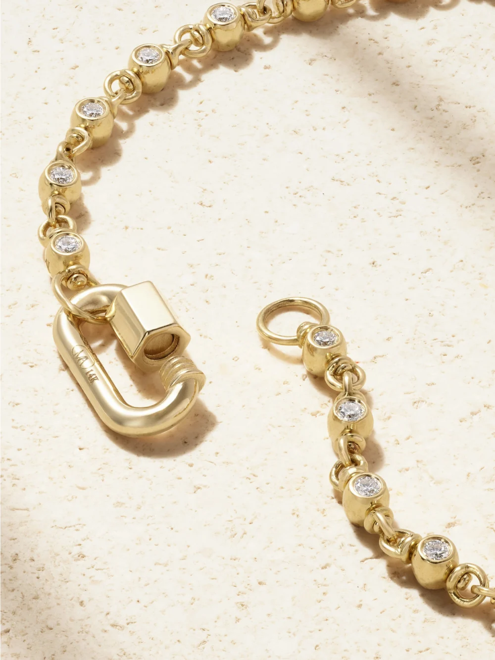 Back view of the Marla Aaron Rolling Cans Chain + Chubby Babylock 18-karat Gold Diamond Necklace