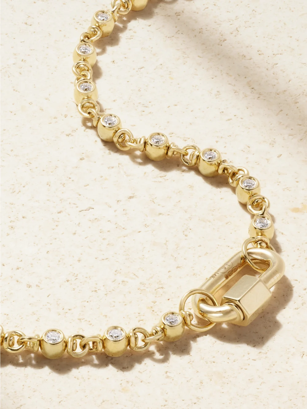 Close-up detail of the Marla Aaron Rolling Cans Chain + Chubby Babylock 18-karat Gold Diamond Necklace