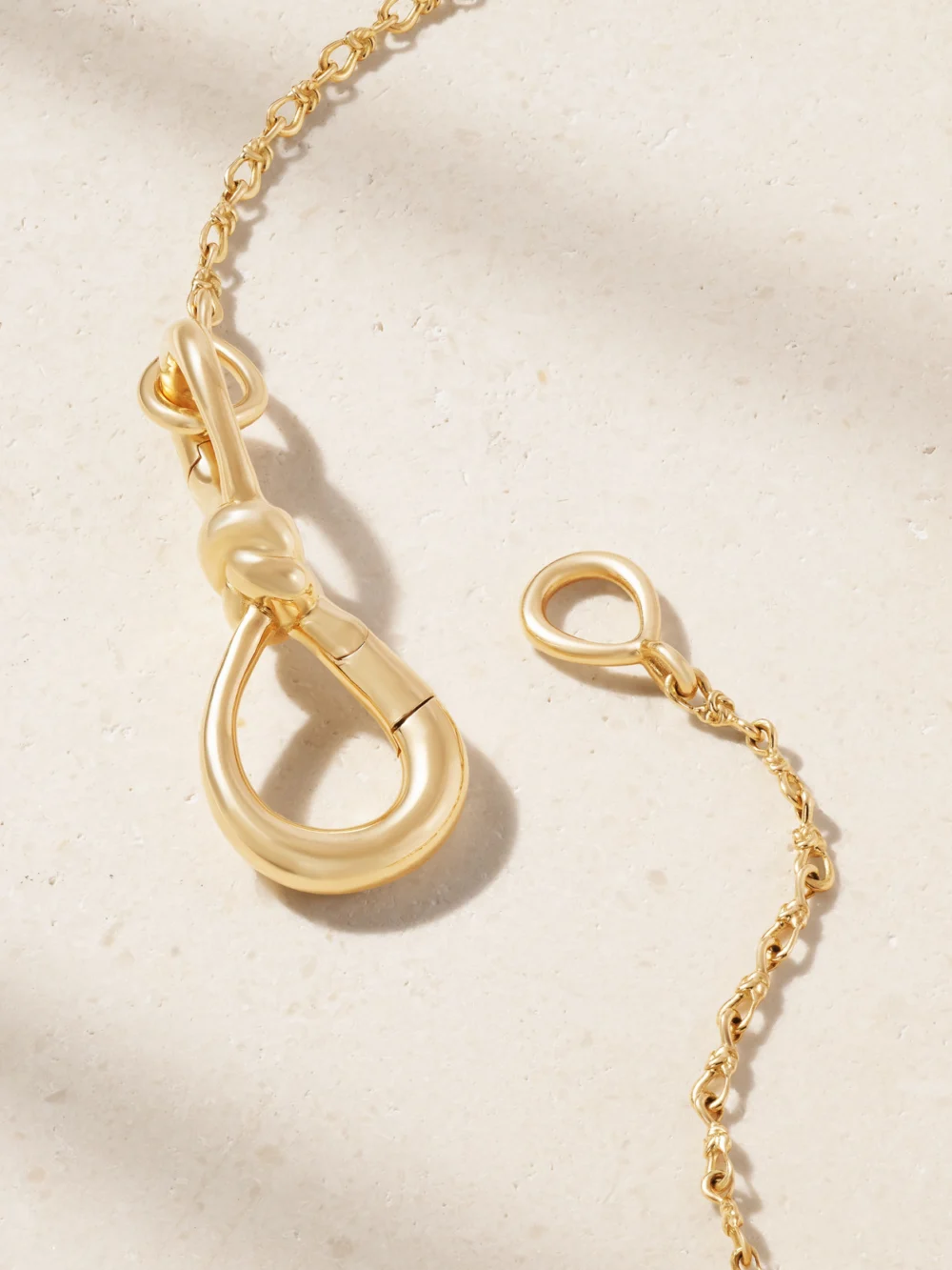 Back view of the Marla Aaron Small True Lover's Knot Lock + Chain 18-karat Gold Necklace
