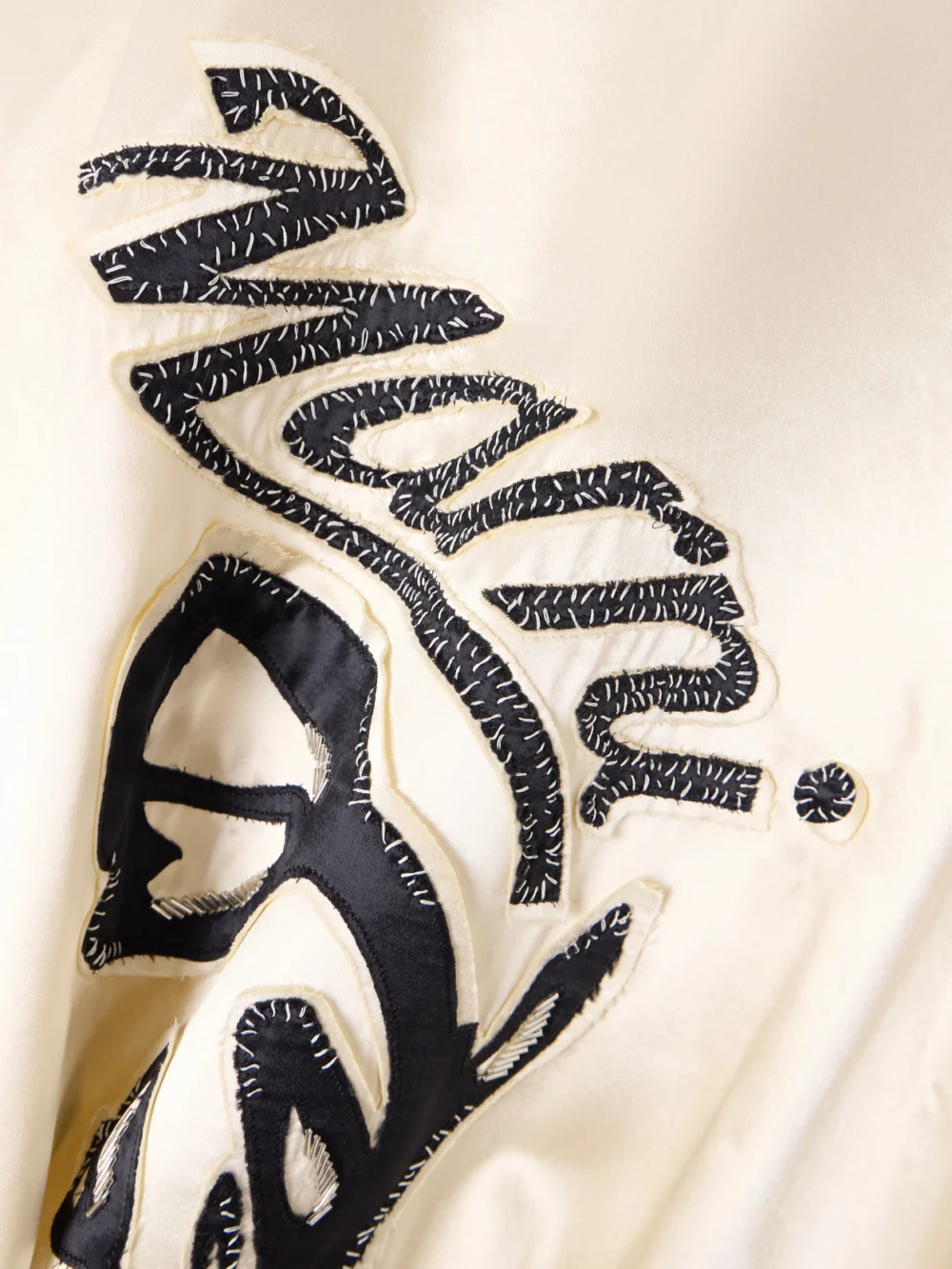 Close-up detail of the Marni Appliquéd Two-tone Satin Bomber Jacket