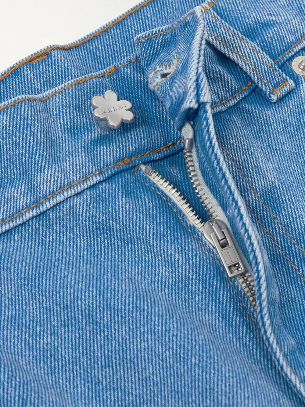 Close-up detail of the Marni Cropped Appliquéd Mid-rise Straight-leg Jeans