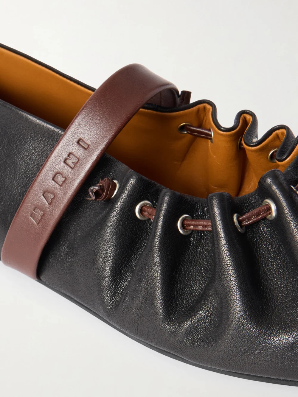 Close-up detail of the Marni Dancer Bow-detailed Leather Ballet Flats