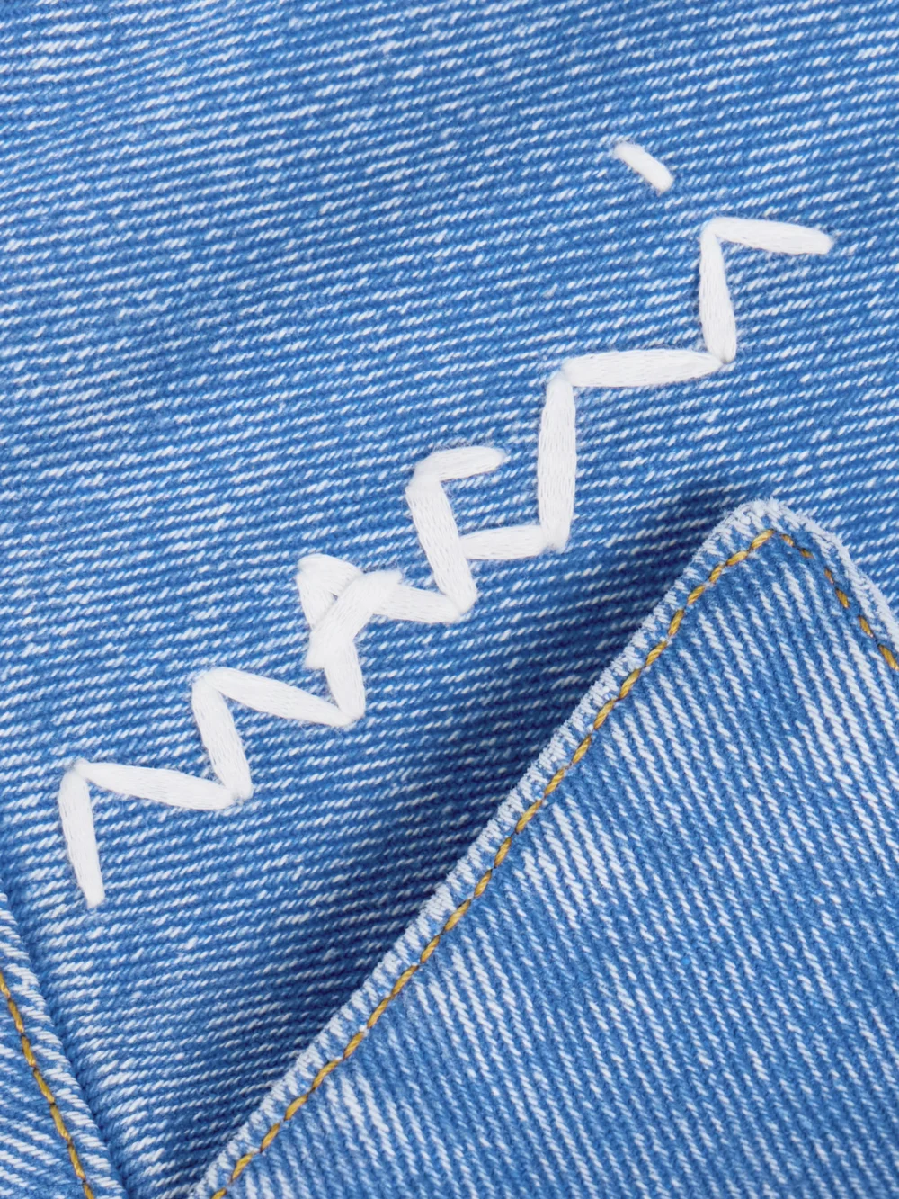 Close-up detail of the Marni Embroidered Frayed Denim Shirt