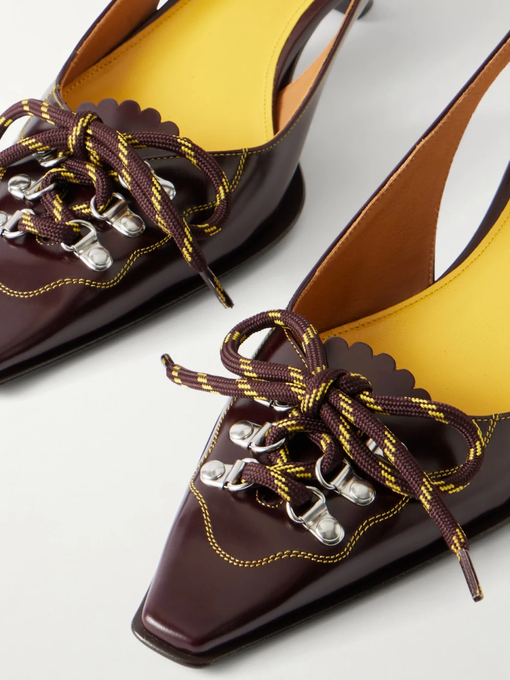 Close-up detail of the Marni Lace-up Leather Slingback Pumps