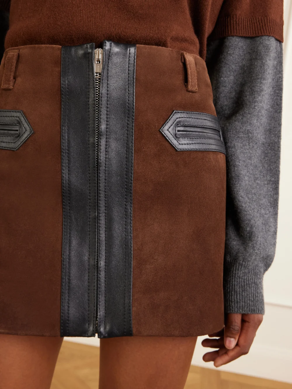Close-up detail of the Marni Leather-trimmed Suede Mini Skirt