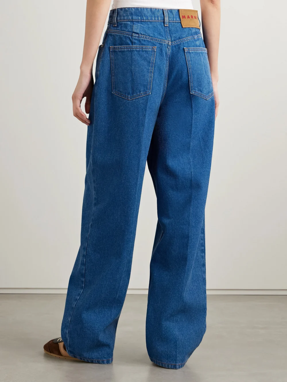 Back view of the Marni Pleated Low-rise Wide-leg Jeans