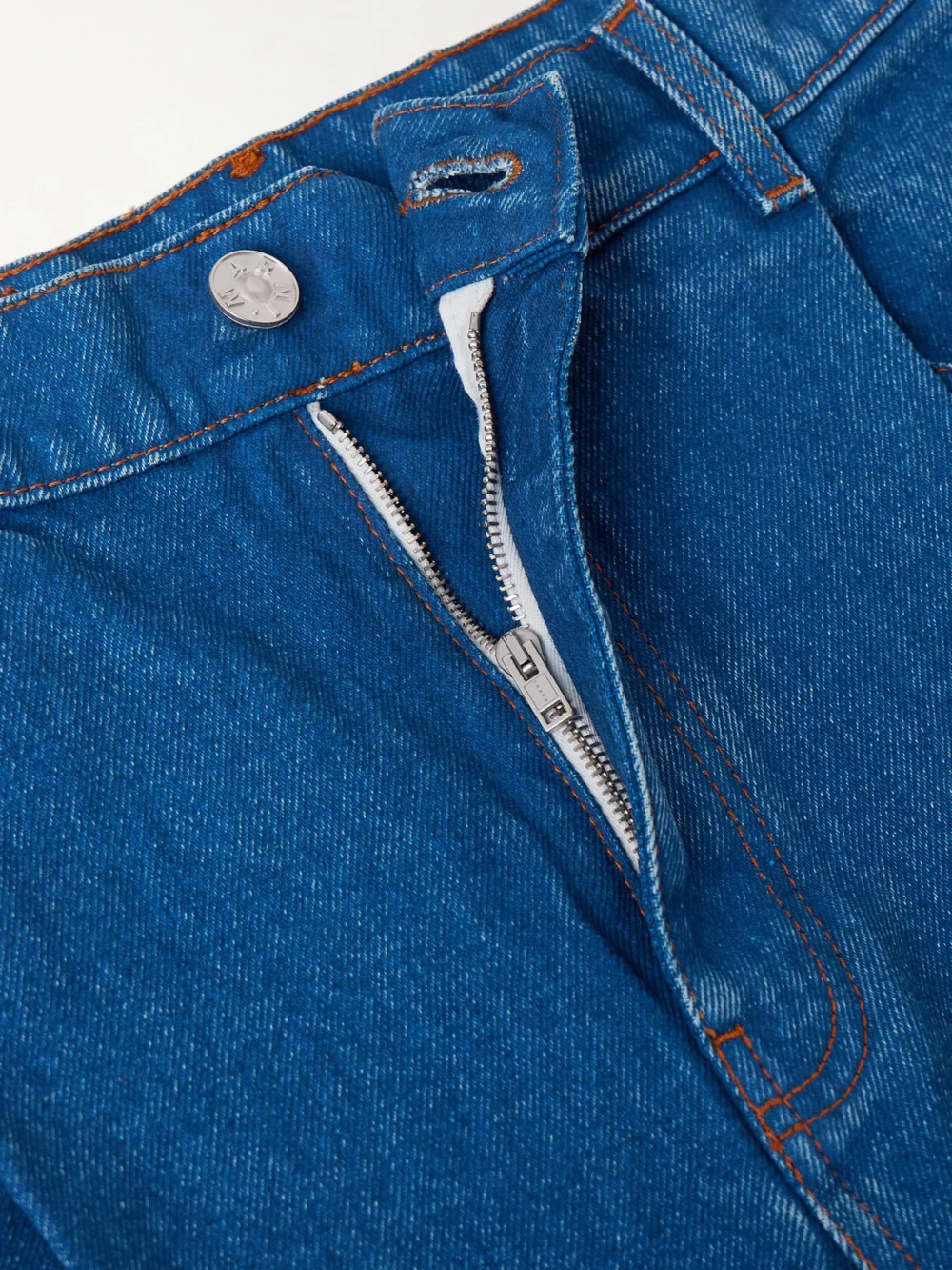 Close-up detail of the Marni Pleated Low-rise Wide-leg Jeans