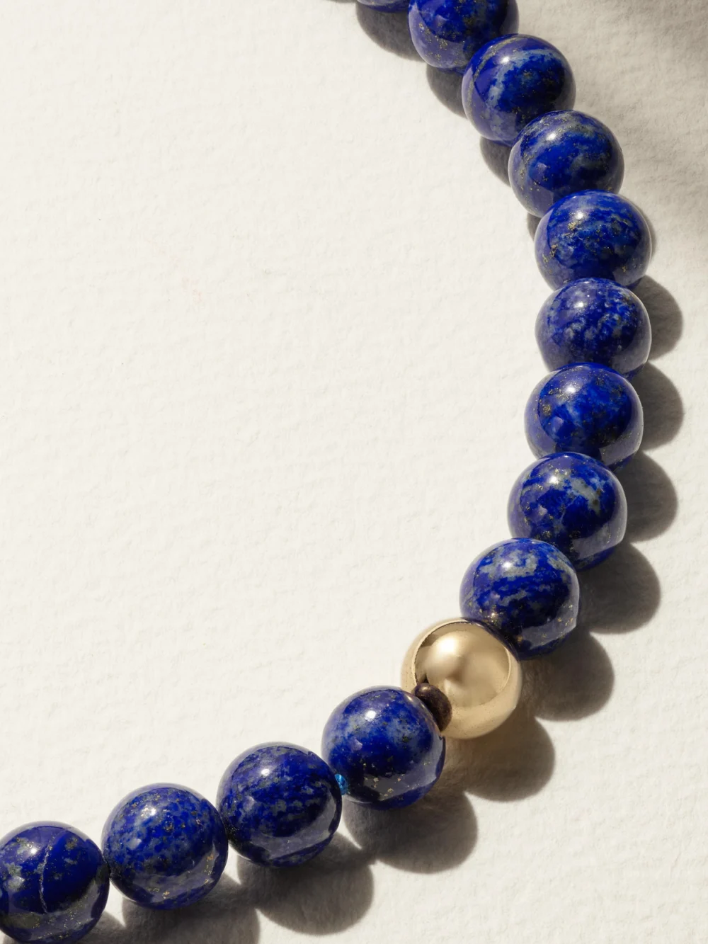 Close-up detail of the Mateo 14-karat Gold Lapis Lazuli Necklace