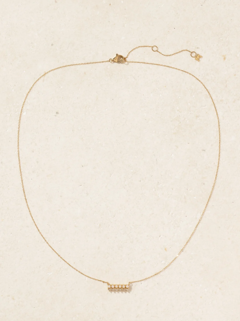 Close-up detail of the Mateo The Little Things 14-karat Gold, Diamond and Pearl Necklace