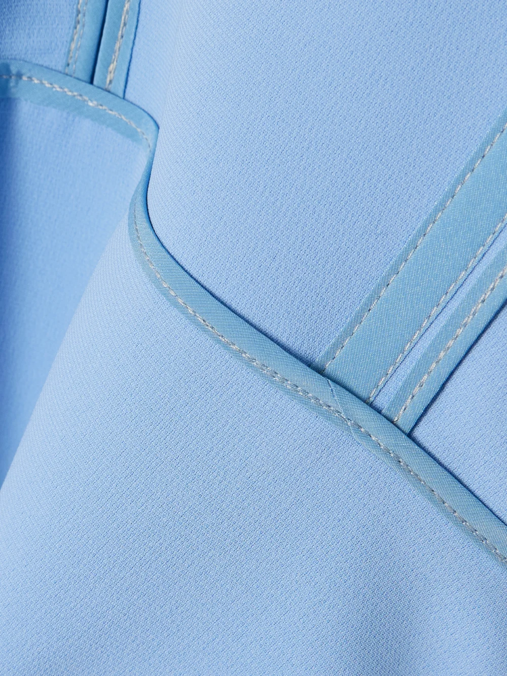 Close-up detail of the Maticevski Wingtip Draped Crepe Midi Dress
