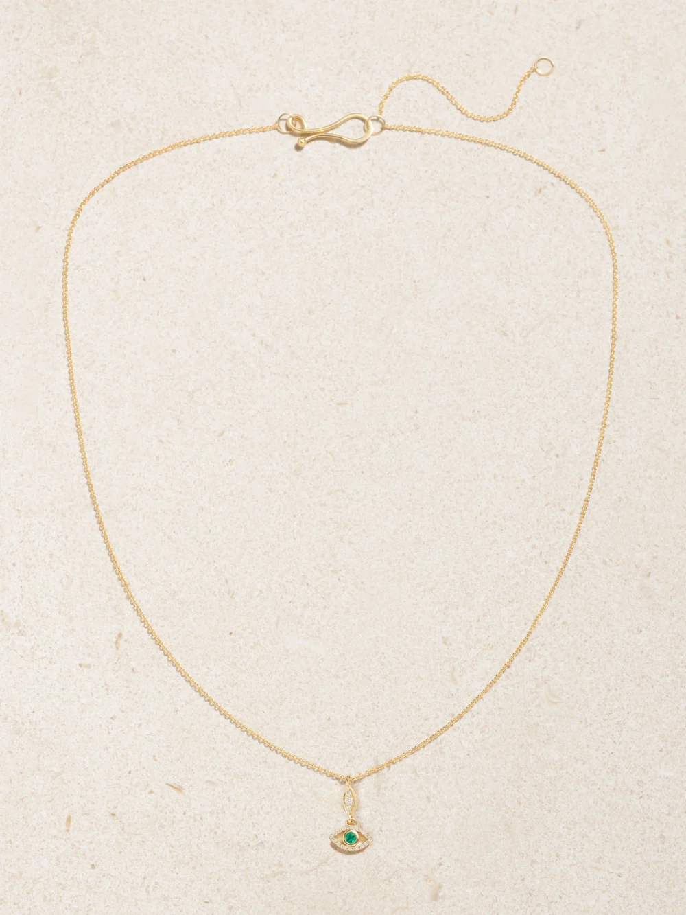 Close-up detail of the Melissa Joy Manning 14-karat Recycled Gold, Emerald and Diamond Necklace