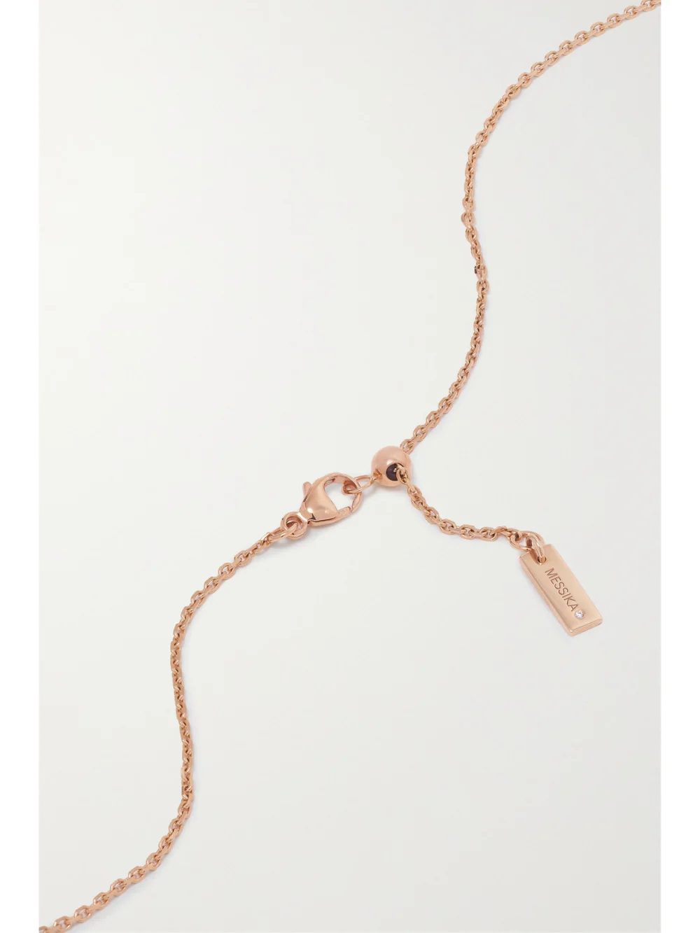 Back view of the Messika Lucky Move 18-karat Rose Gold, Onyx and Diamond Necklace