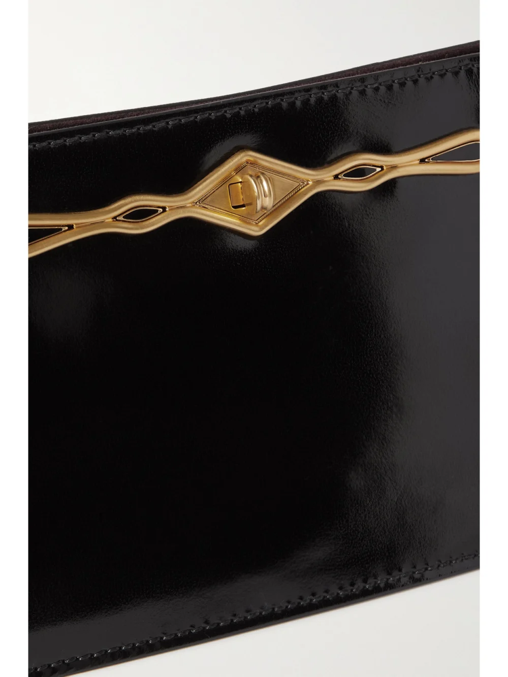 Close-up detail of the Métier + Fernando Jorge Ease Embellished Glossed-leather Clutch