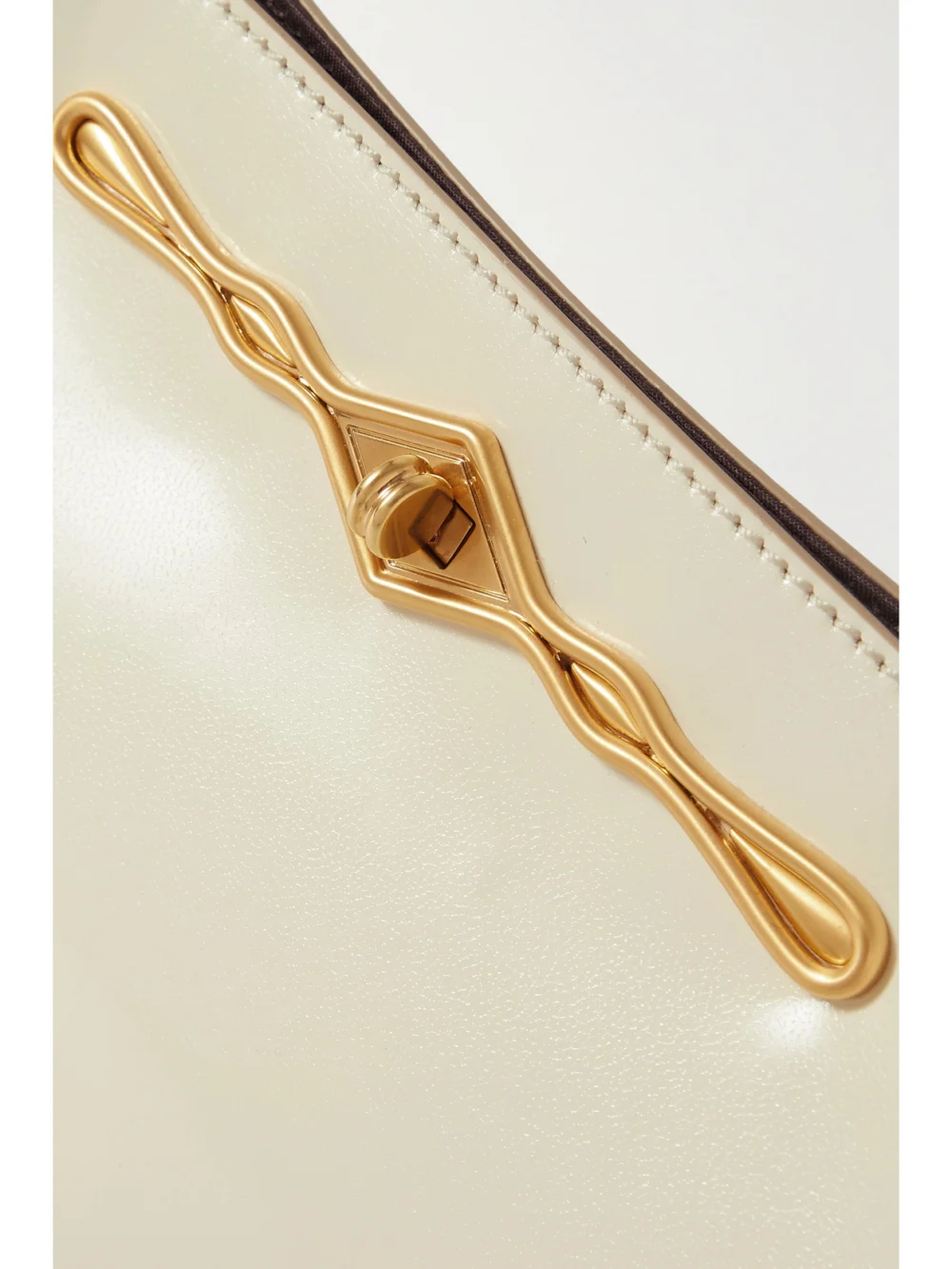Close-up detail of the Métier + Fernando Jorge Ease Embellished Glossed-leather Clutch