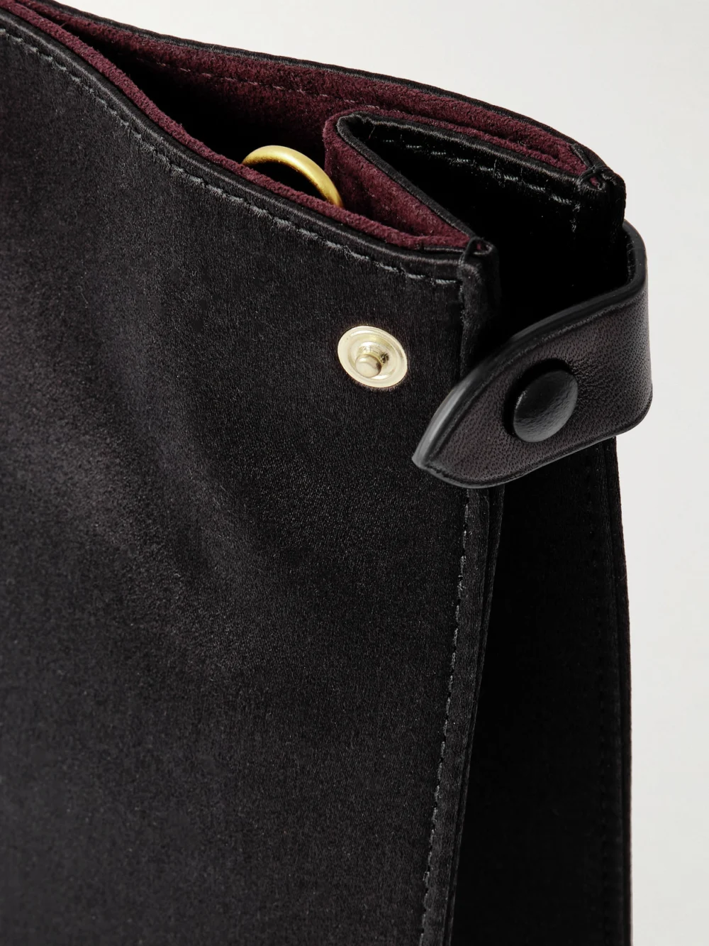 Close-up detail of the Métier Stowaway Leather-trimmed Satin Shoulder Bag