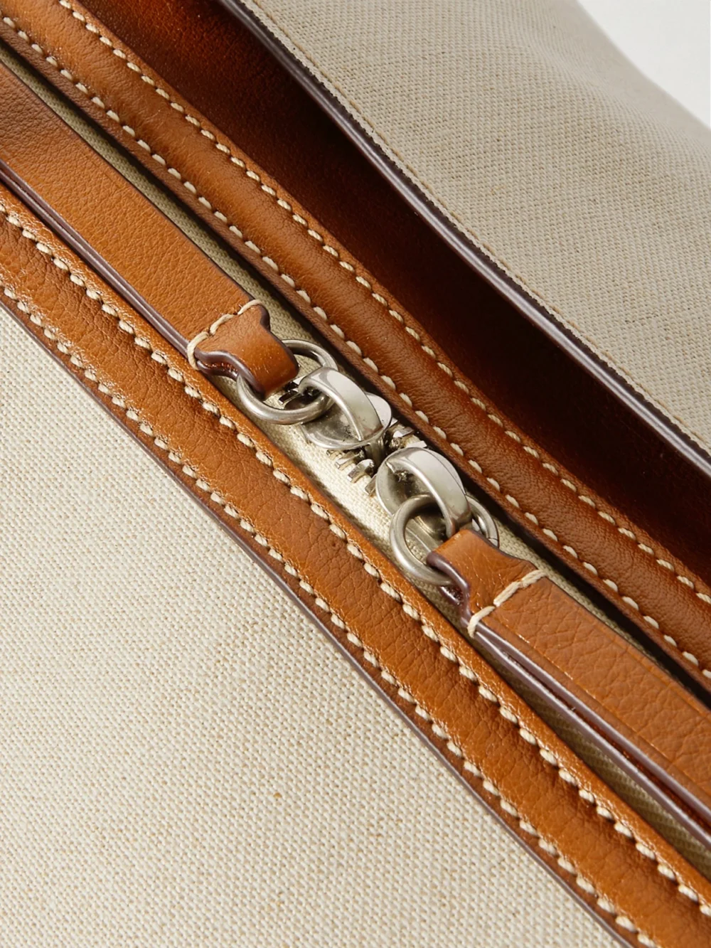 Close-up detail of the Métier Vérité Weekend Leather-trimmed Linen-canvas Tote