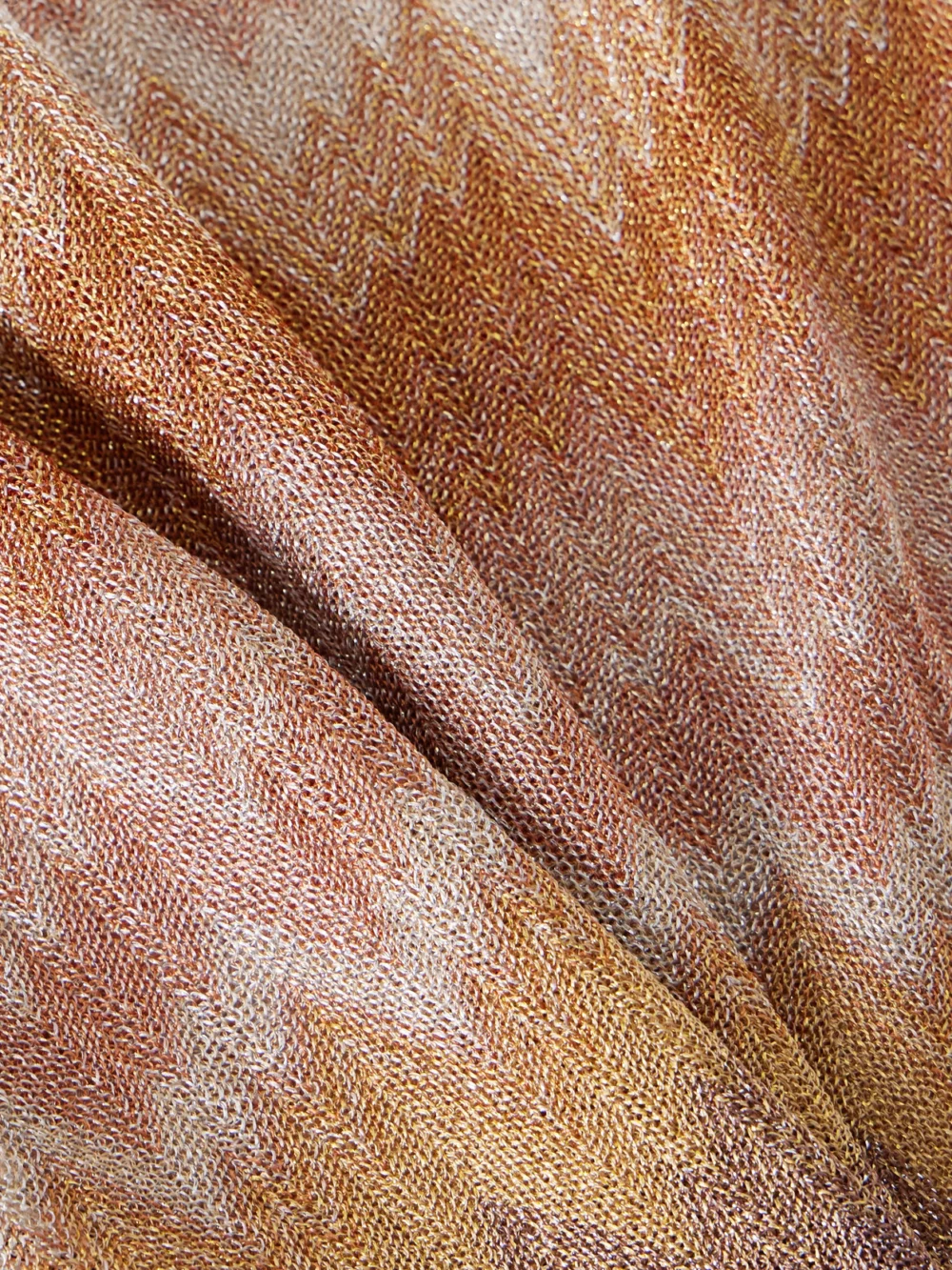 Close-up detail of the Missoni Metallic Striped Crochet-knit Mini Dress