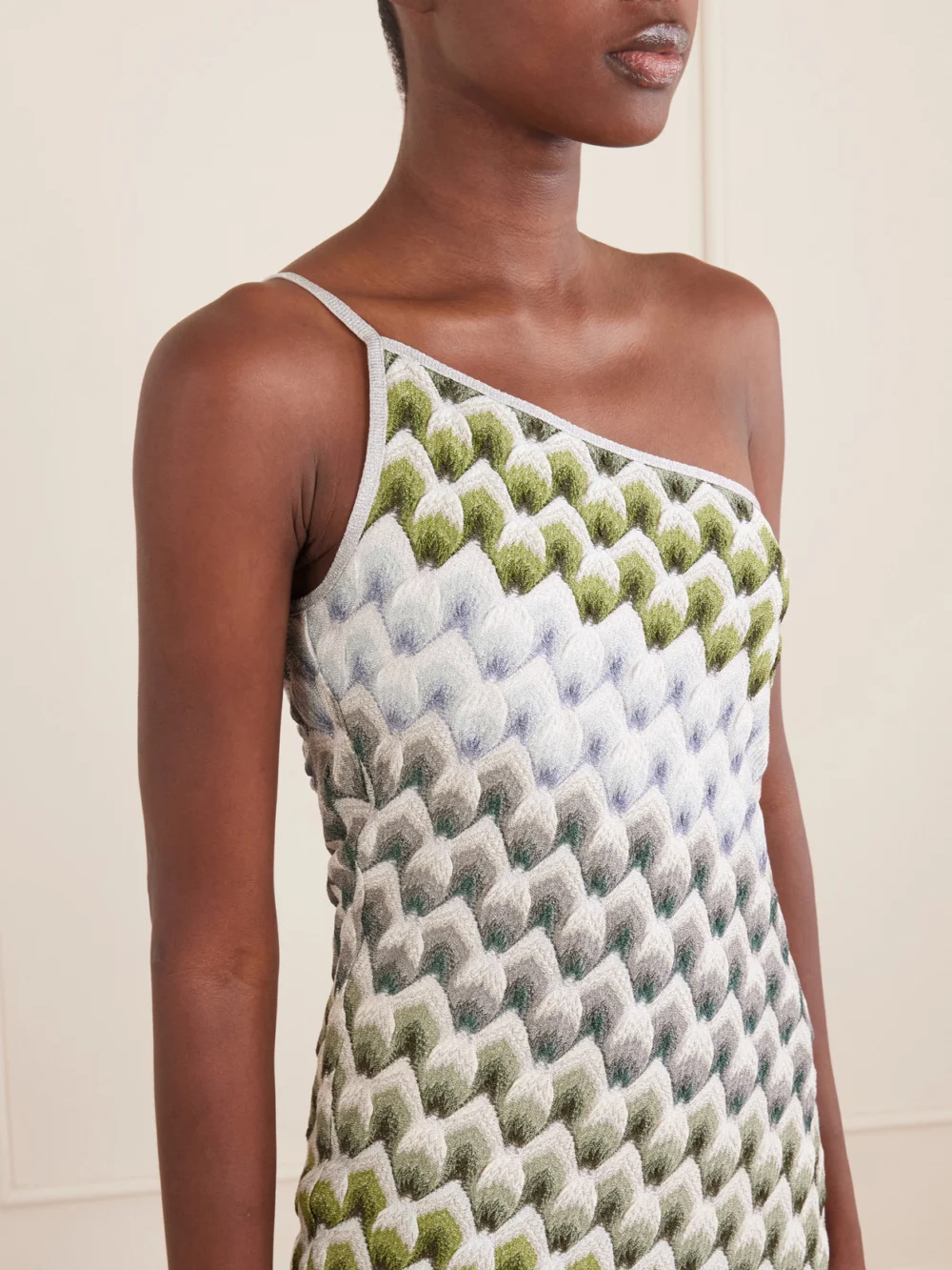 Close-up detail of the Missoni One-shoulder Metallic Crochet-knit Mini Dress