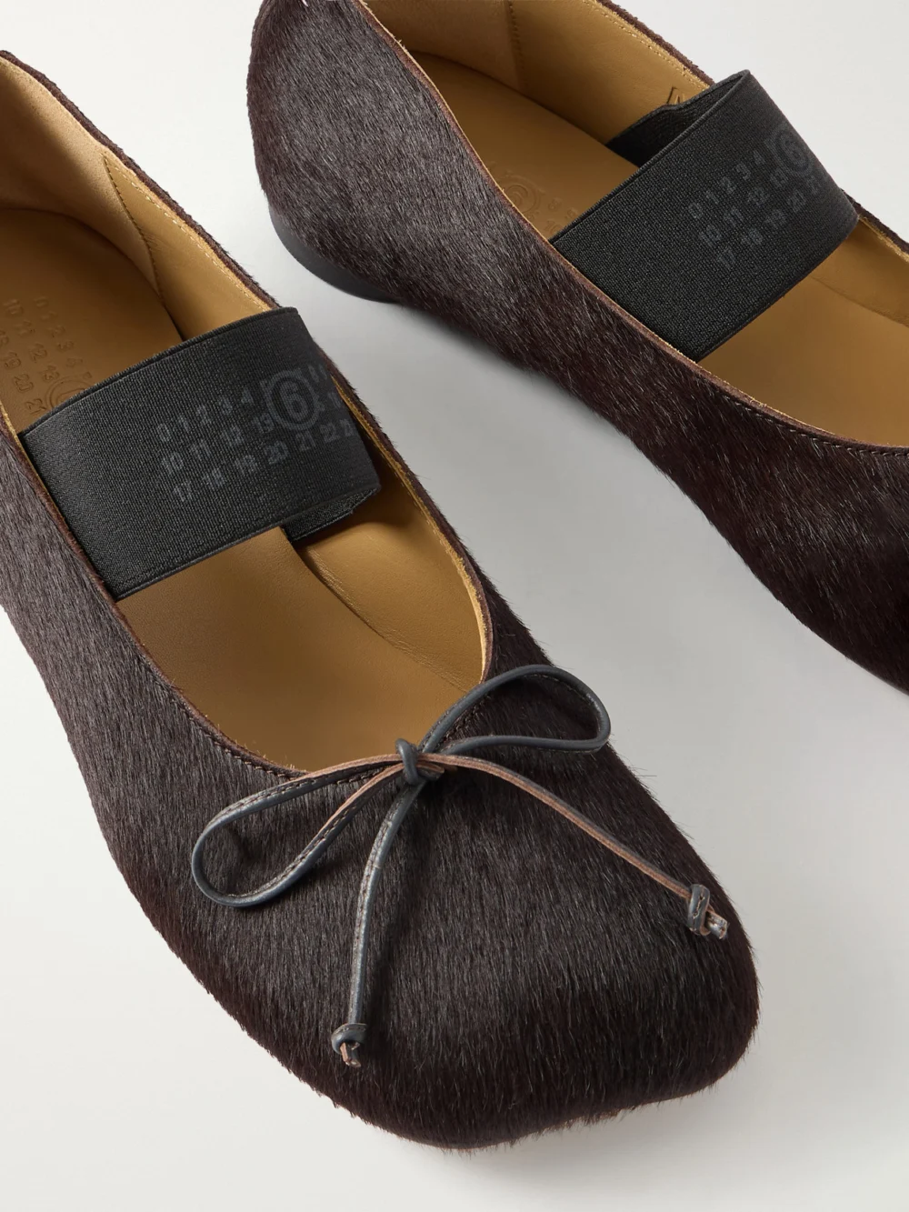 Close-up detail of the MM6 Maison Margiela Bow-detailed Calf Hair Ballet Flats