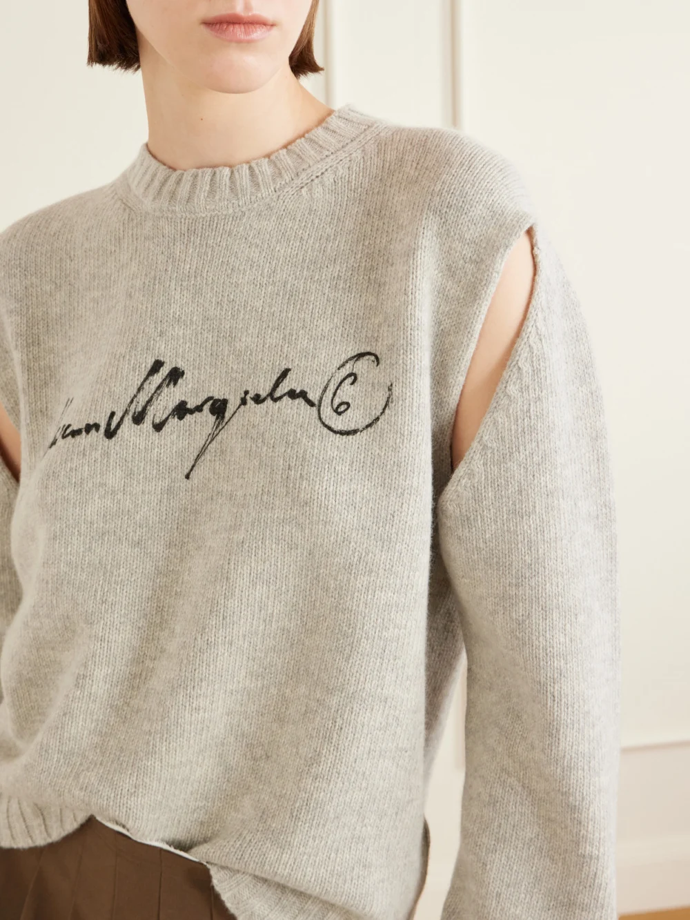 Close-up detail of the MM6 Maison Margiela Logo-print Cut-out Wool-blend Sweater