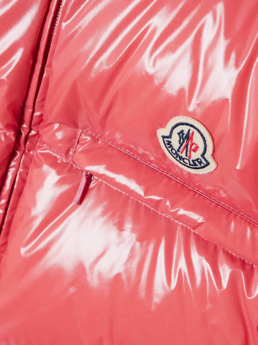 Close-up detail of the Moncler Almo Convertible Appliquéd Quilted Glossed-shell Down Jacket