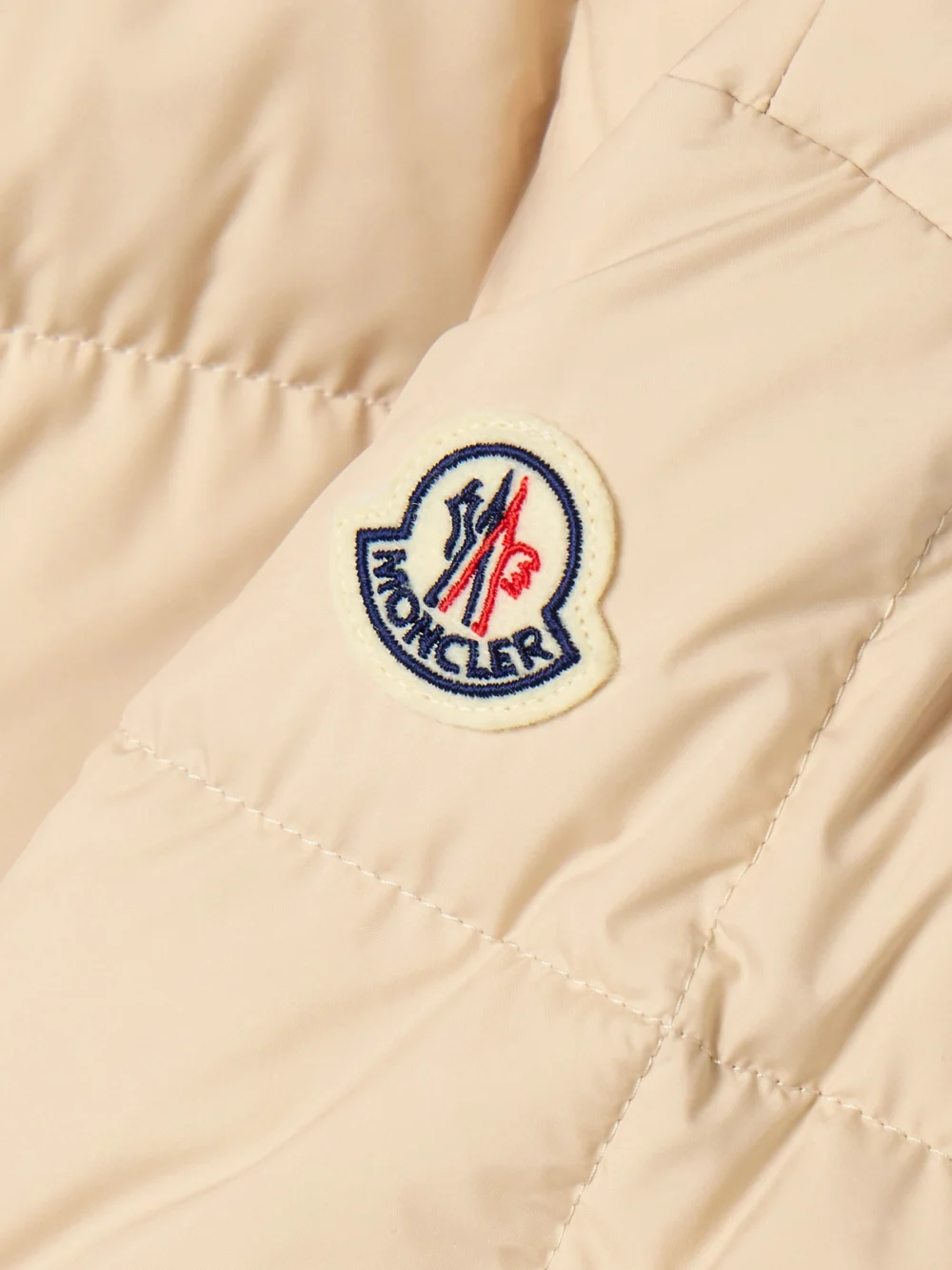 Close-up detail of the Moncler Antigone Ribbed-knit and Leather-trimmed Padded Quilted Shell Down Jacket
