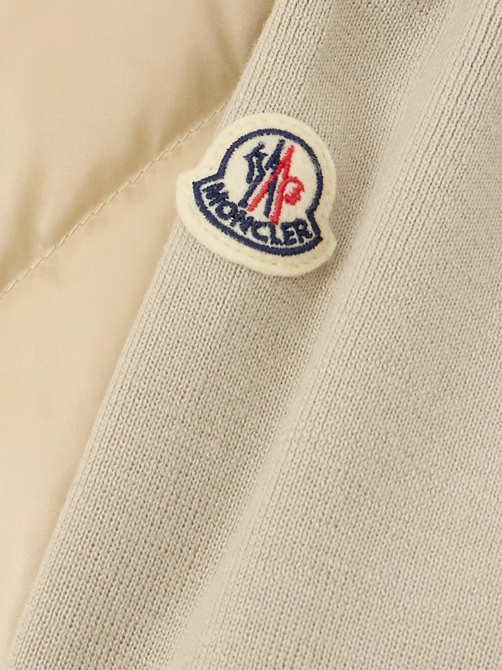 Close-up detail of the Moncler Apliquéd Wool and Quilted Shell Down Cardigan