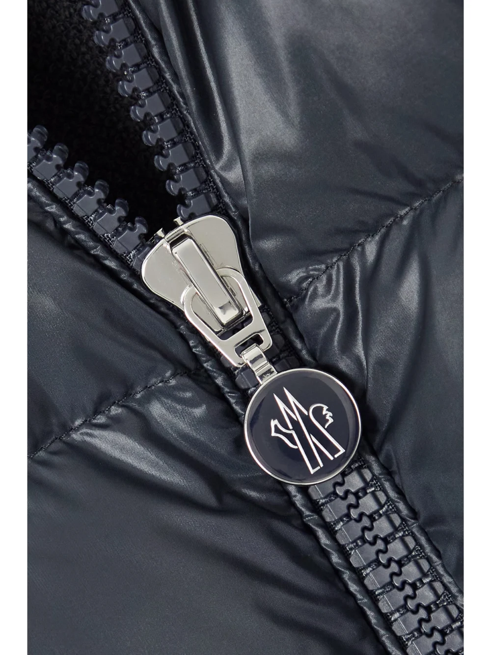 Close-up detail of the Moncler Appliquéd Cotton-blend Jersey and Quilted Shell Down Jacket