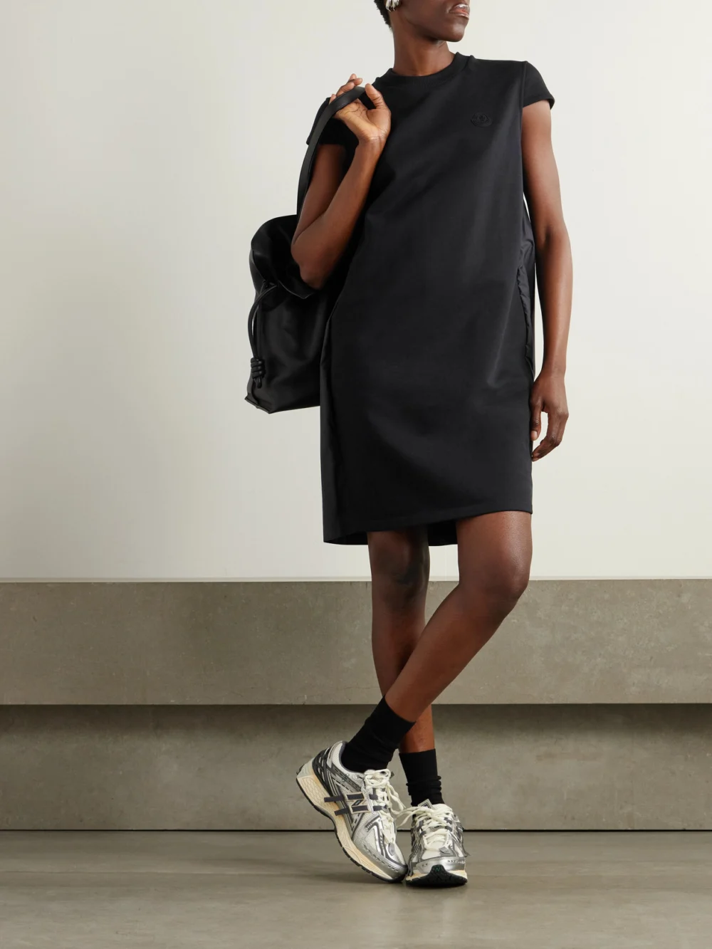 Moncler Appliquéd Cotton-jersey and Pleated Shell Mini Dress, worn by a model