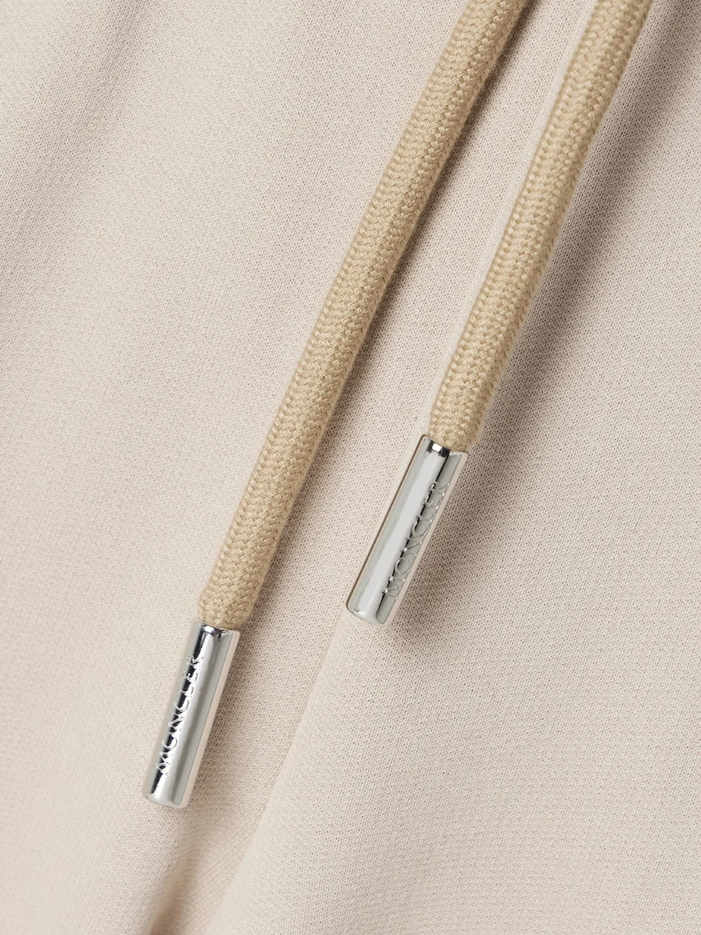 Close-up detail of the Moncler Appliquéd Cotton-jersey Tapered Track Pants