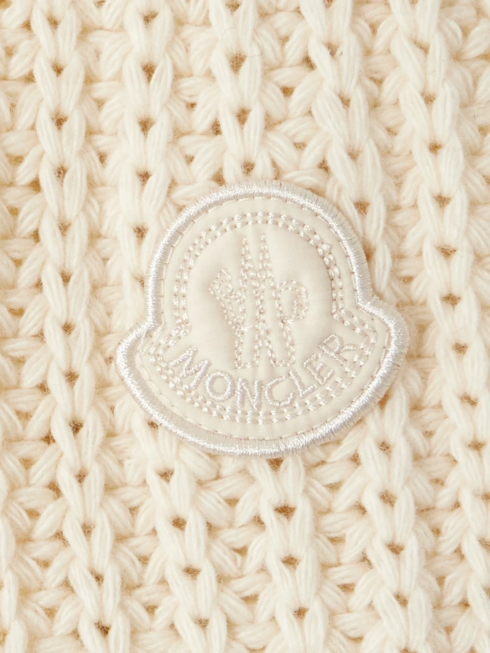 Close-up detail of the Moncler Appliquéd Quilted Shell-trimmed Wool and Cashmere-blend Down Cardigan