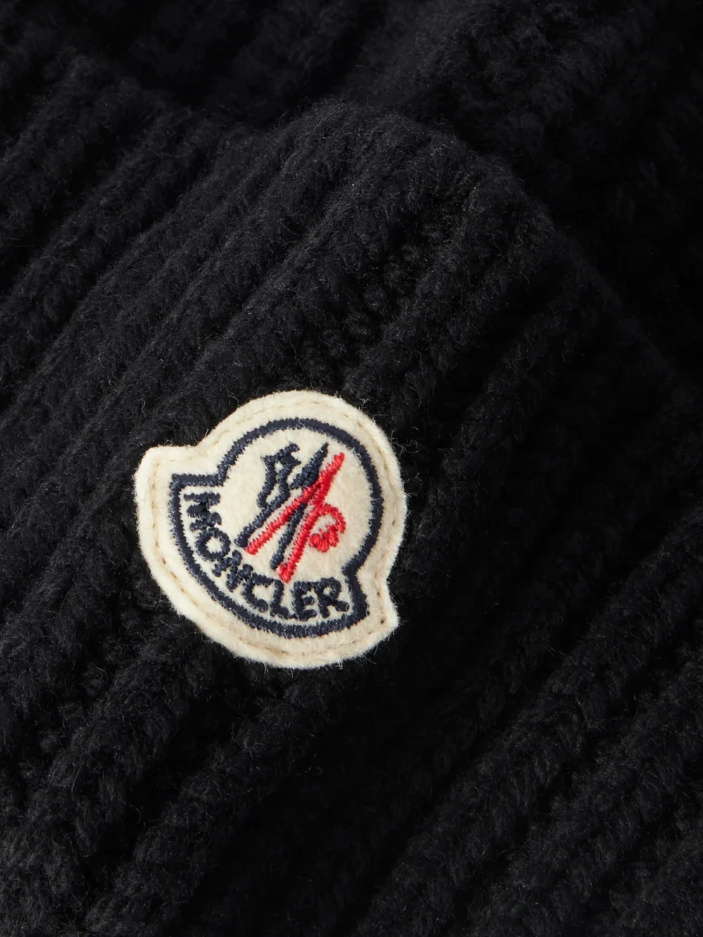 Close-up detail of the Moncler Appliquéd Ribbed Wool and Cashmere-blend Beanie