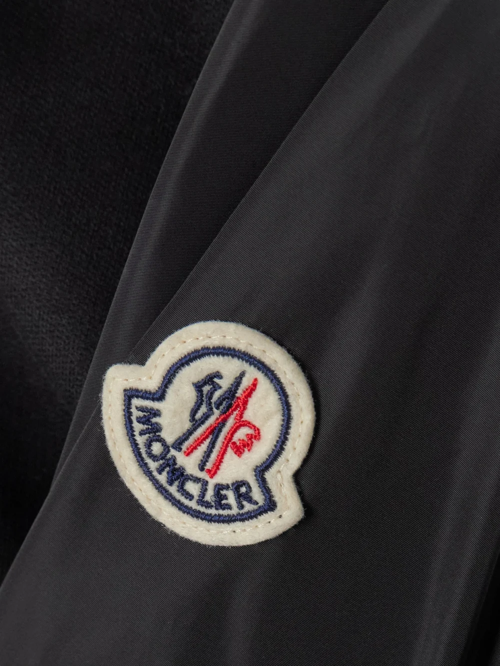 Close-up detail of the Moncler Appliquéd Shell-trimmed Cotton-jersey T-shirt