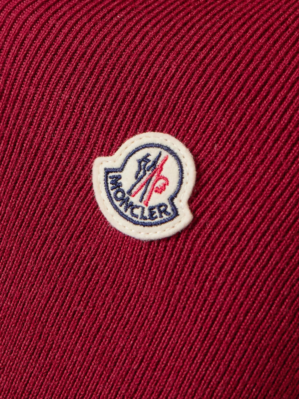 Close-up detail of the Moncler Appliquéd Wool-blend and Quilted Shell Down Cardigan
