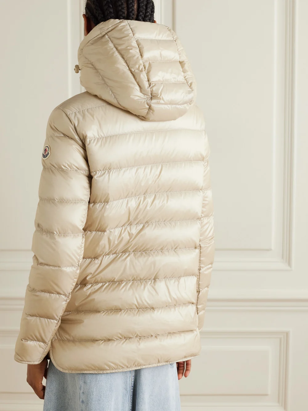 Back view of the Moncler Argenno Hooded Belted Appliquéd Quilted Shell Down Coat