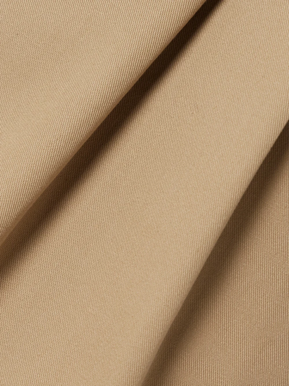Close-up detail of the Moncler Belted Pleated Twill Mini Skirt