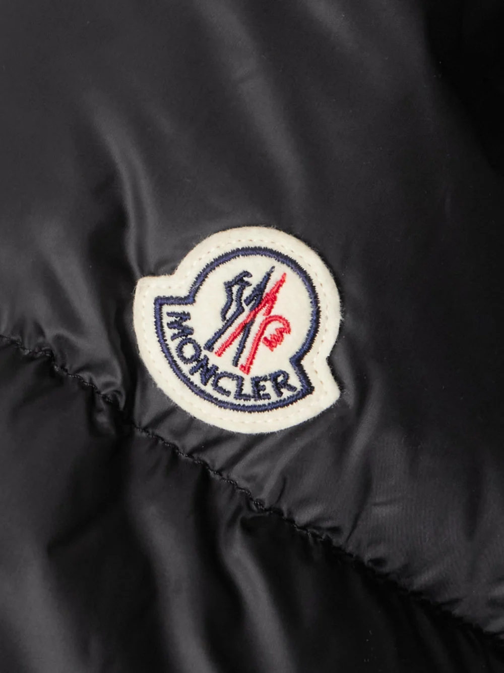 Close-up detail of the Moncler Boulogne Reversible Hooded Quilted Down Coat