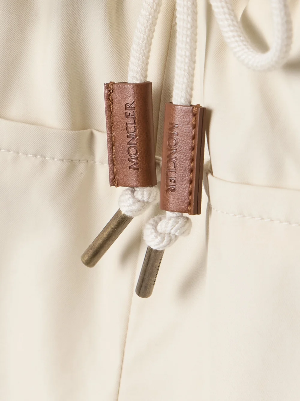 Close-up detail of the Moncler Canvas-trimmed Paneled Cotton-blend Shell Shorts