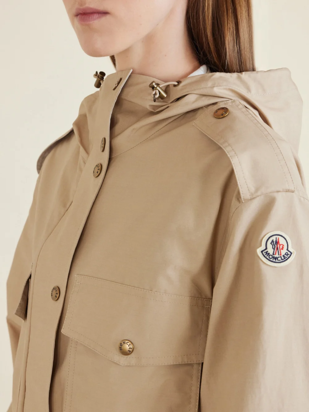 Close-up detail of the Moncler Carex Hooded Cotton-blend Poplin Cropped Jacket