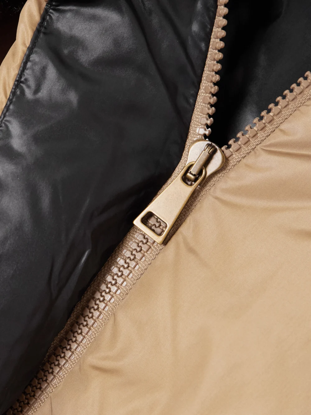 Close-up detail of the Moncler Castelnou Appliquéd Hooded Fleece-trimmed Shell Down Jacket