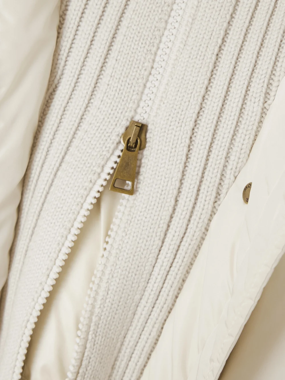 Close-up detail of the Moncler Chamer Hooded Quilted Shell Down Coat
