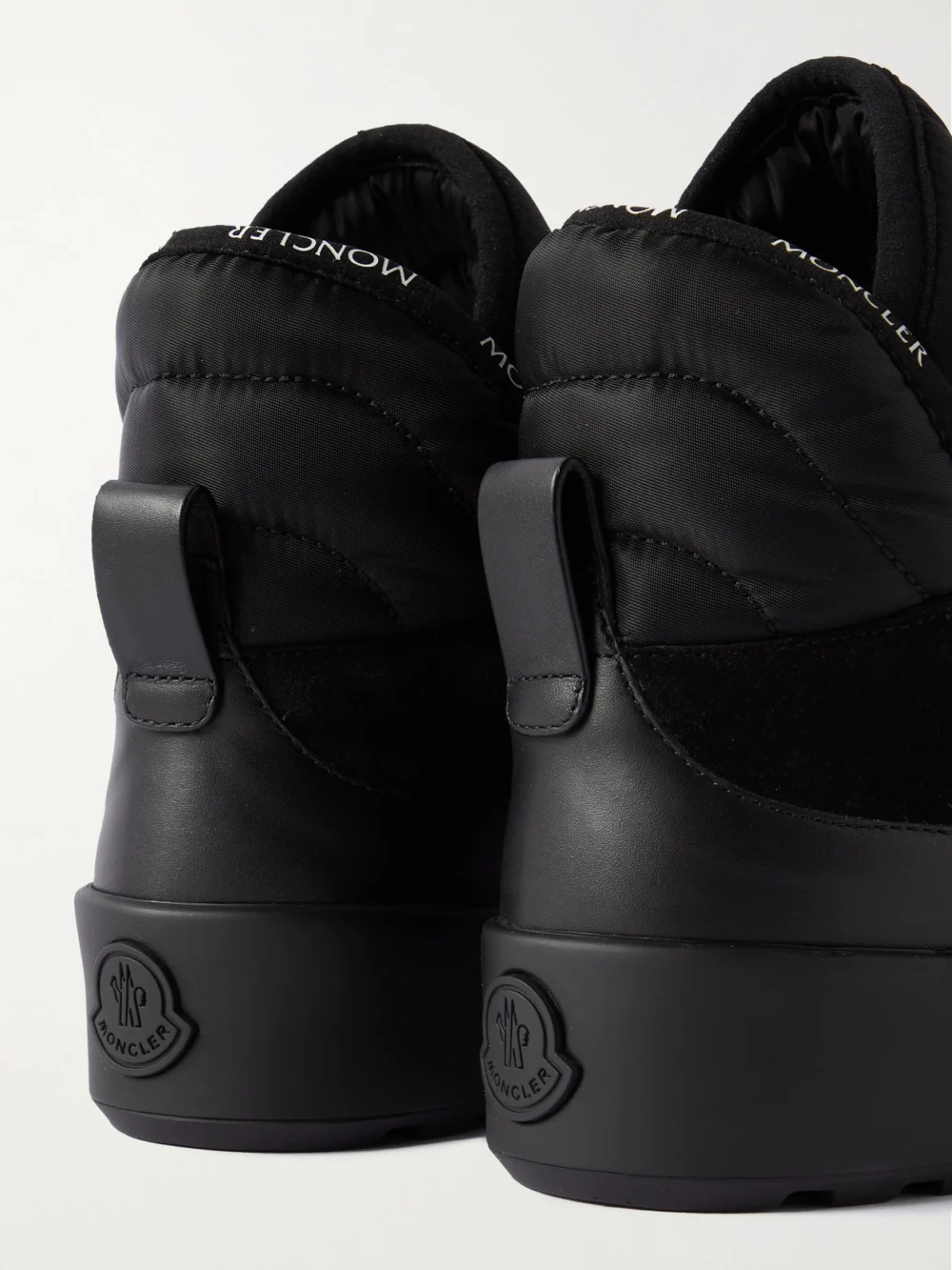 Close-up detail of the Moncler Cross Promyx Suede-trimmed Quilted Shell and Leather High-top Sneakers