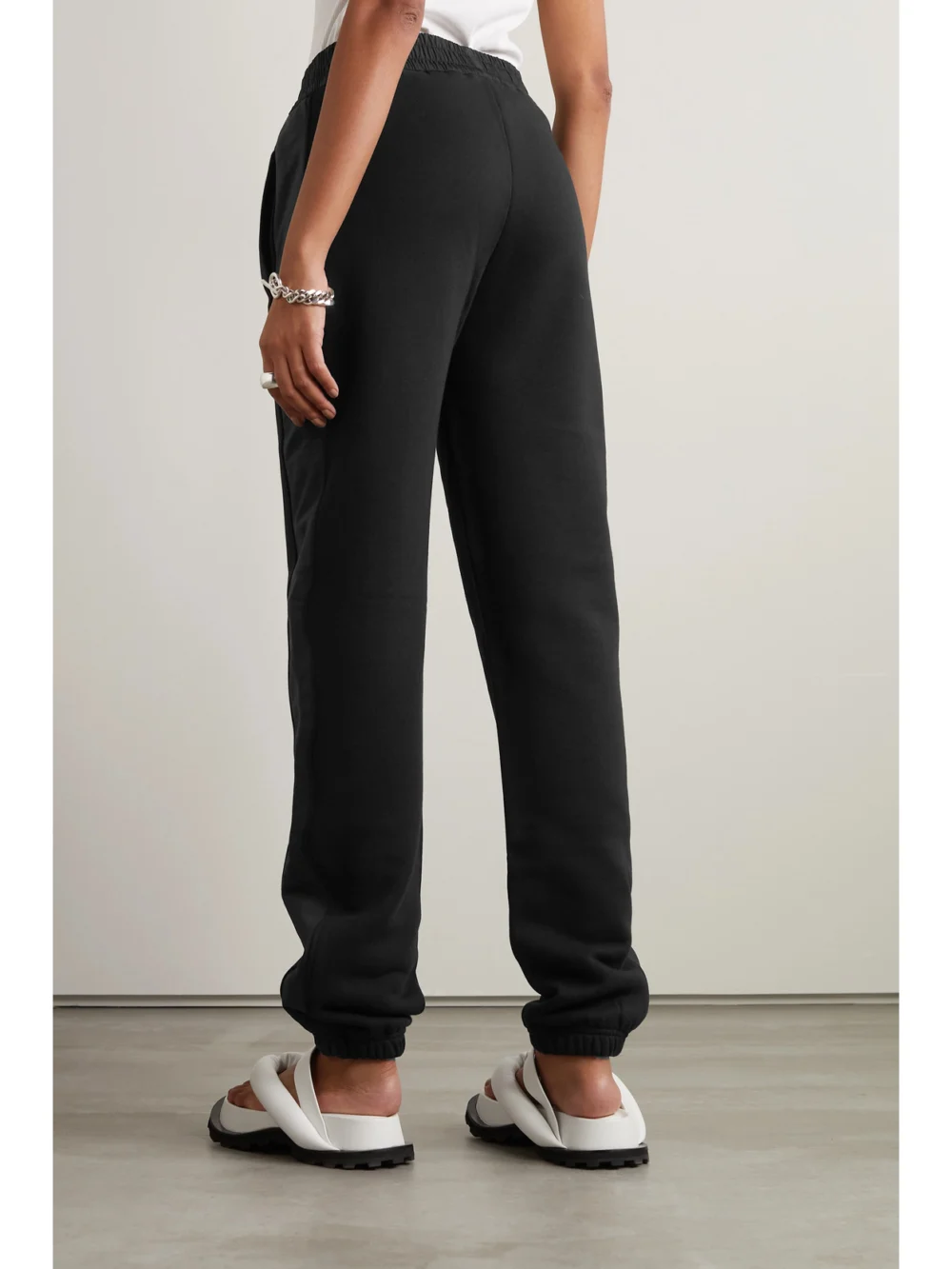 Back view of the Moncler Embellished Shell-trimmed Cotton-jersey Track Pants