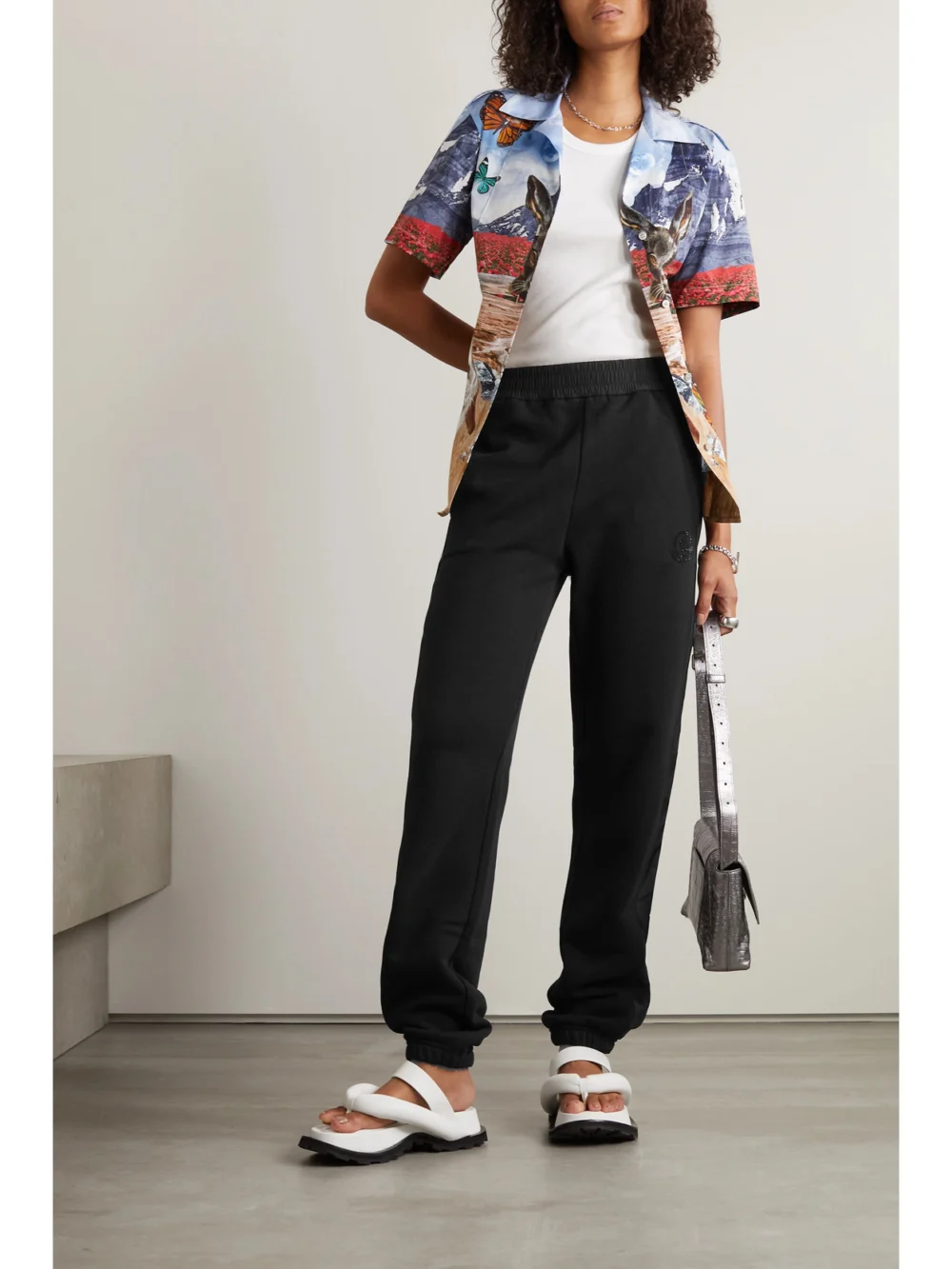 Moncler Embellished Shell-trimmed Cotton-jersey Track Pants, worn by a model