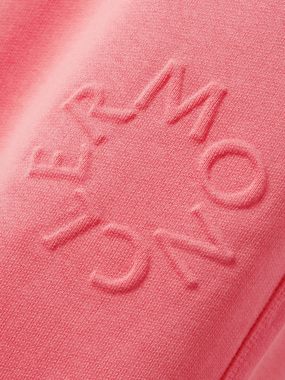 Close-up detail of the Moncler Embossed Cotton-jersey Tapered Track Pants