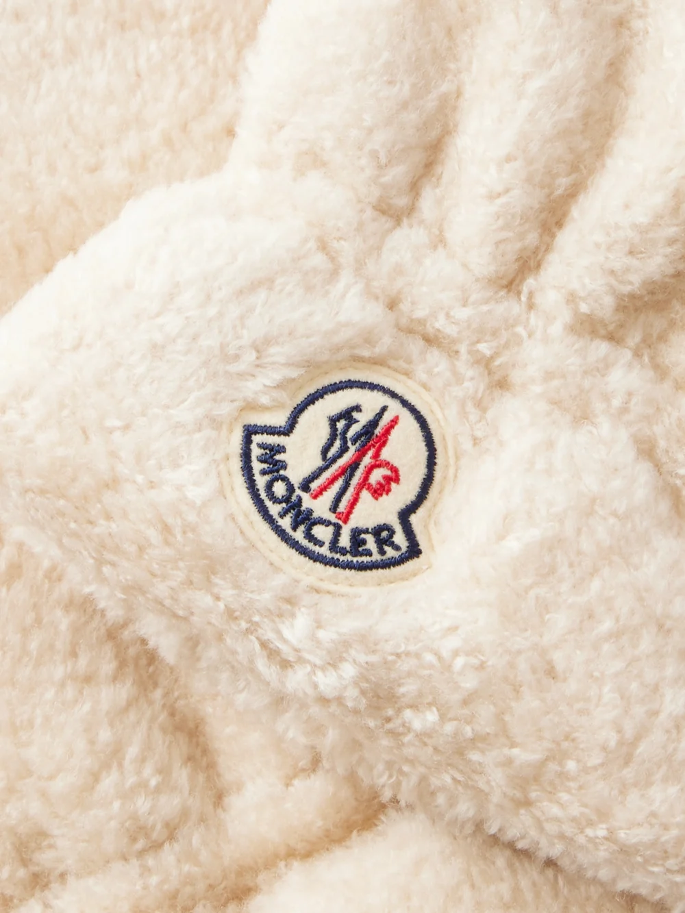 Close-up detail of the Moncler Embroidered Fleece Gloves