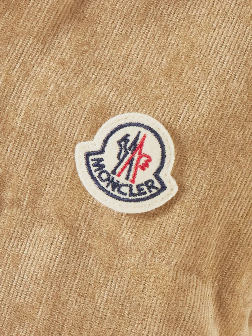 Close-up detail of the Moncler Essarts Ricrac-trimmed Quilted Padded Down Corduroy Jacket