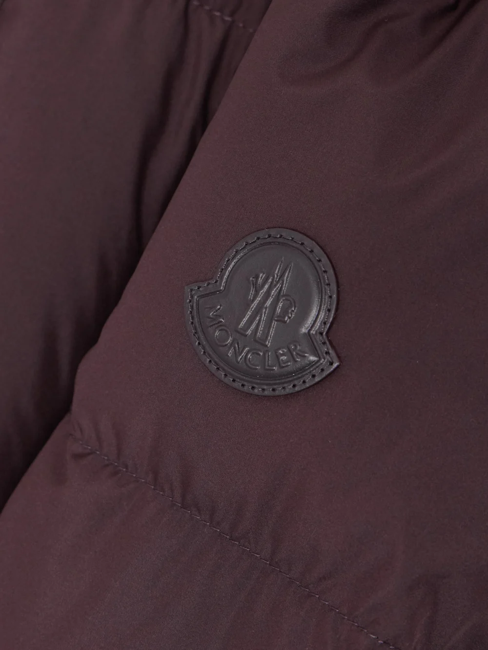 Close-up detail of the Moncler Estom Hooded Quilted Shell Down Jacket