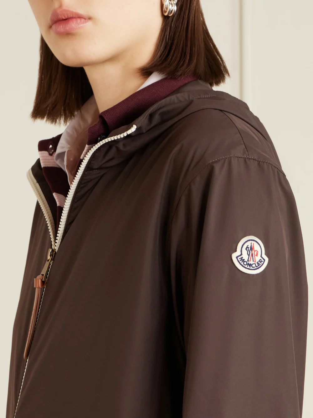 Close-up detail of the Moncler Fegeos Logo-appliquéd Hooded Shell Jacket